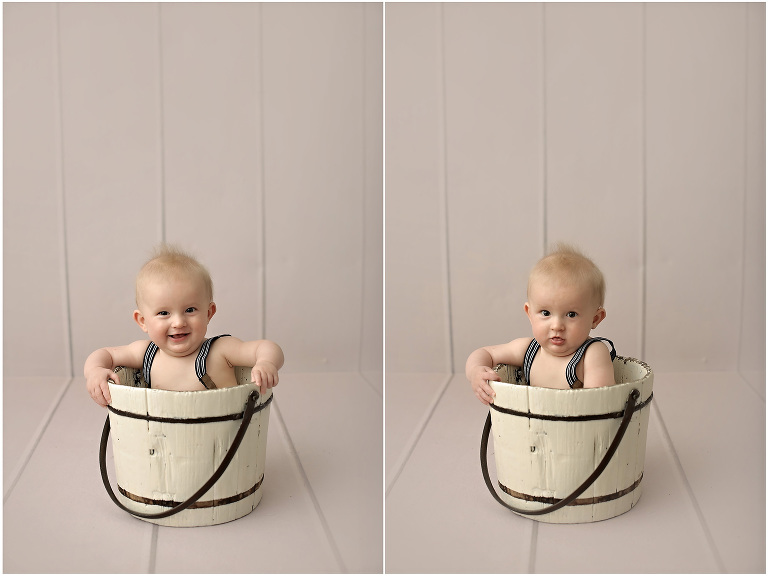 8 month old baby wearing suspenders sitting in whitewashed bucket