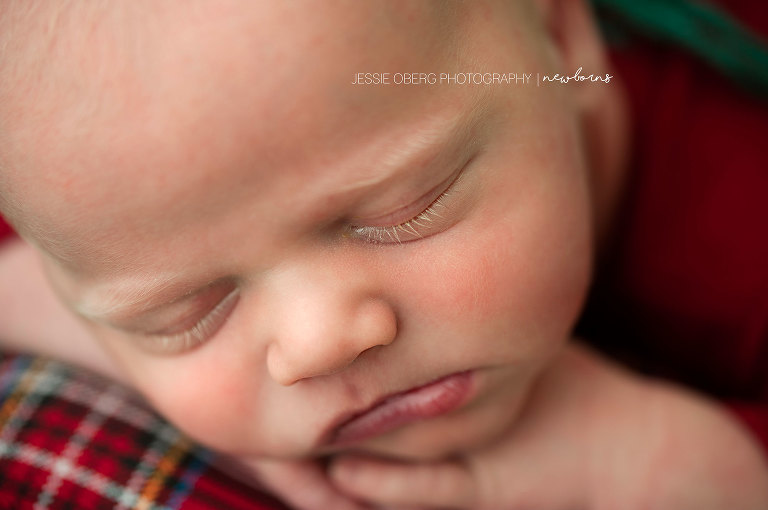 Macro shot of newborn baby boy's blonde eyelashes.